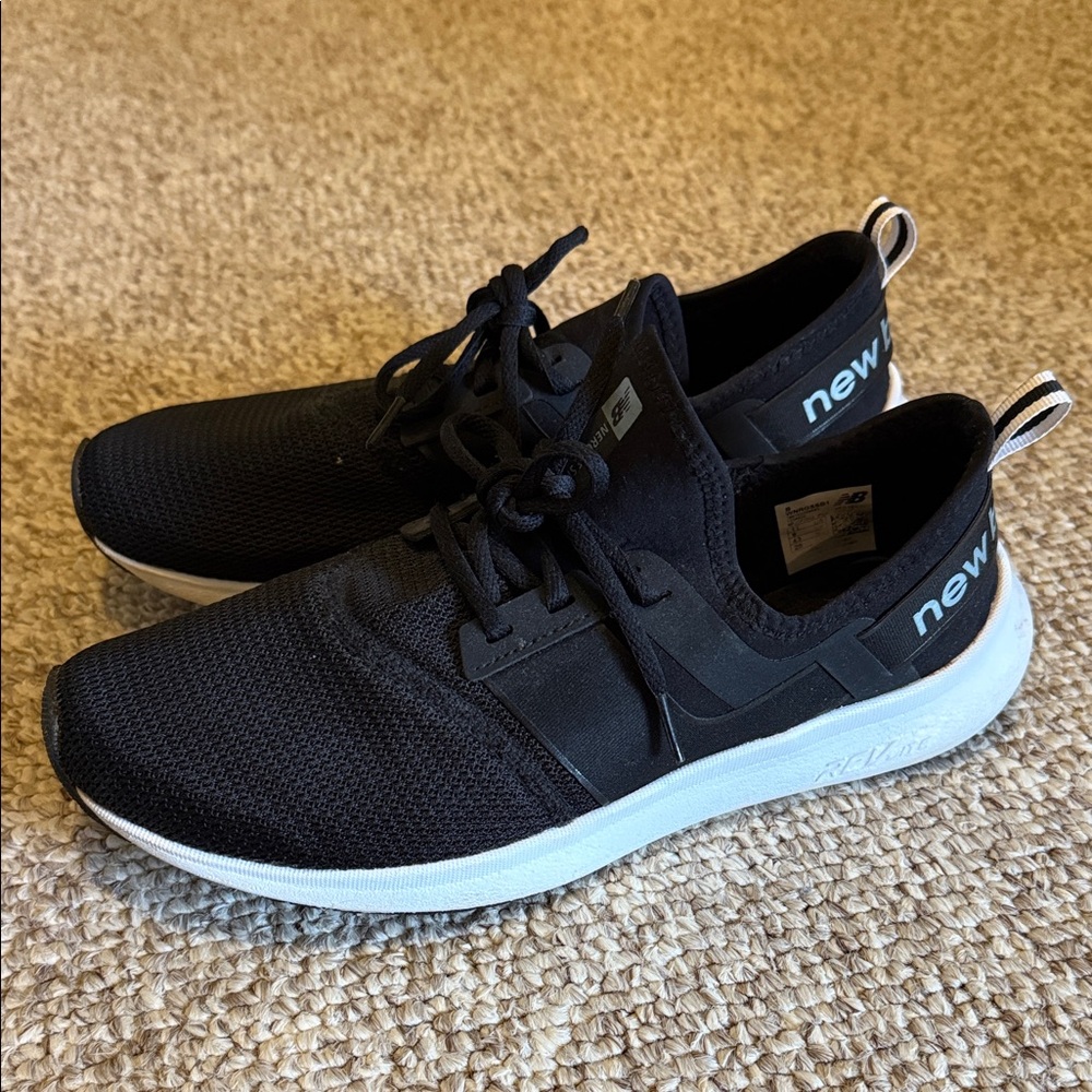 New Balance womens Black and White Sneakers